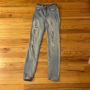 Ripped high rise skinny jeans in light blue